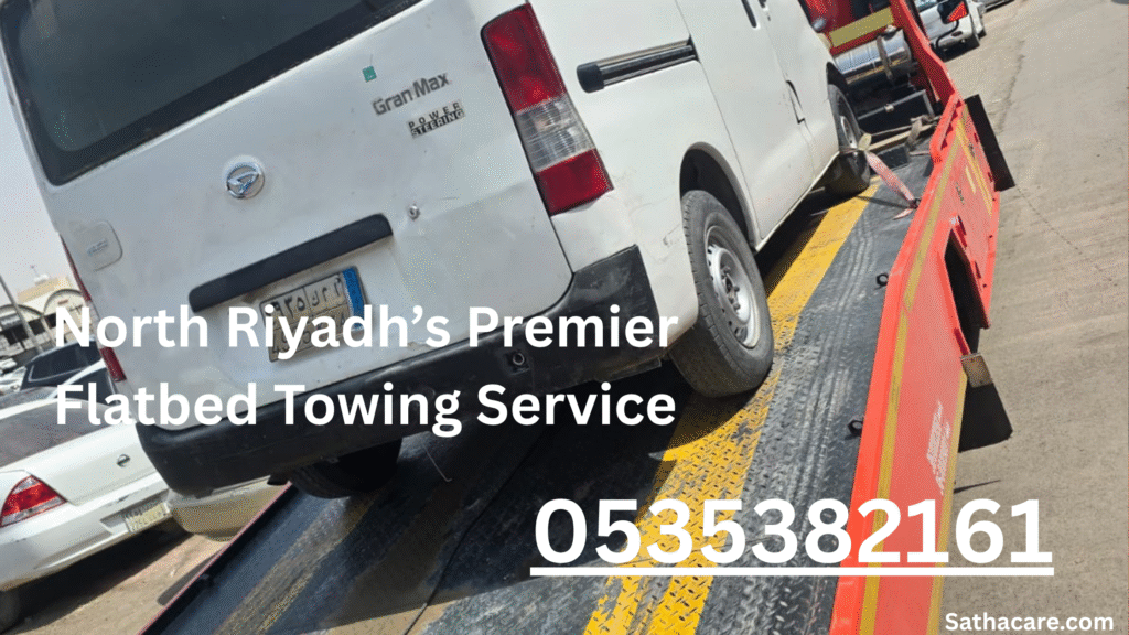 Satha Care’s modern flatbed tow truck parked in North Riyadh’s Al-Rajhi neighborhood, ready for 24/7 roadside assistance.